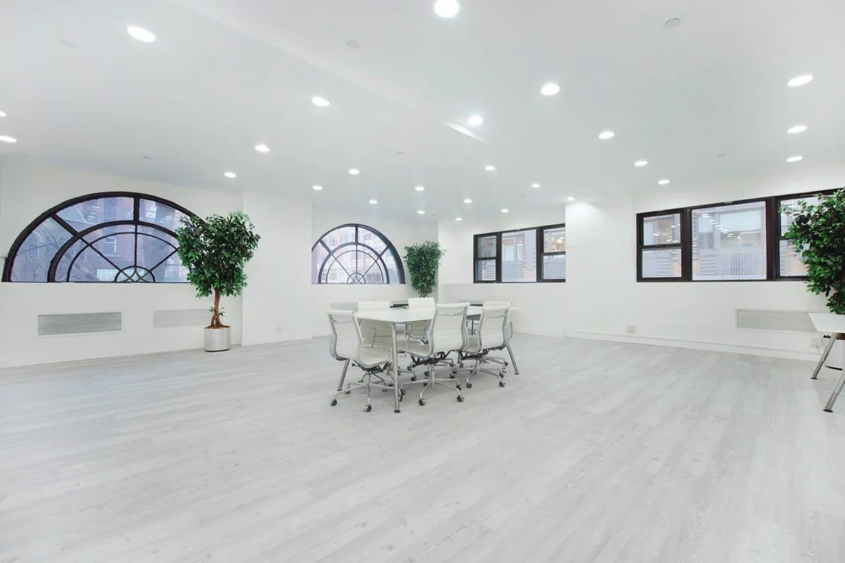 Renovated white floor with arched windows